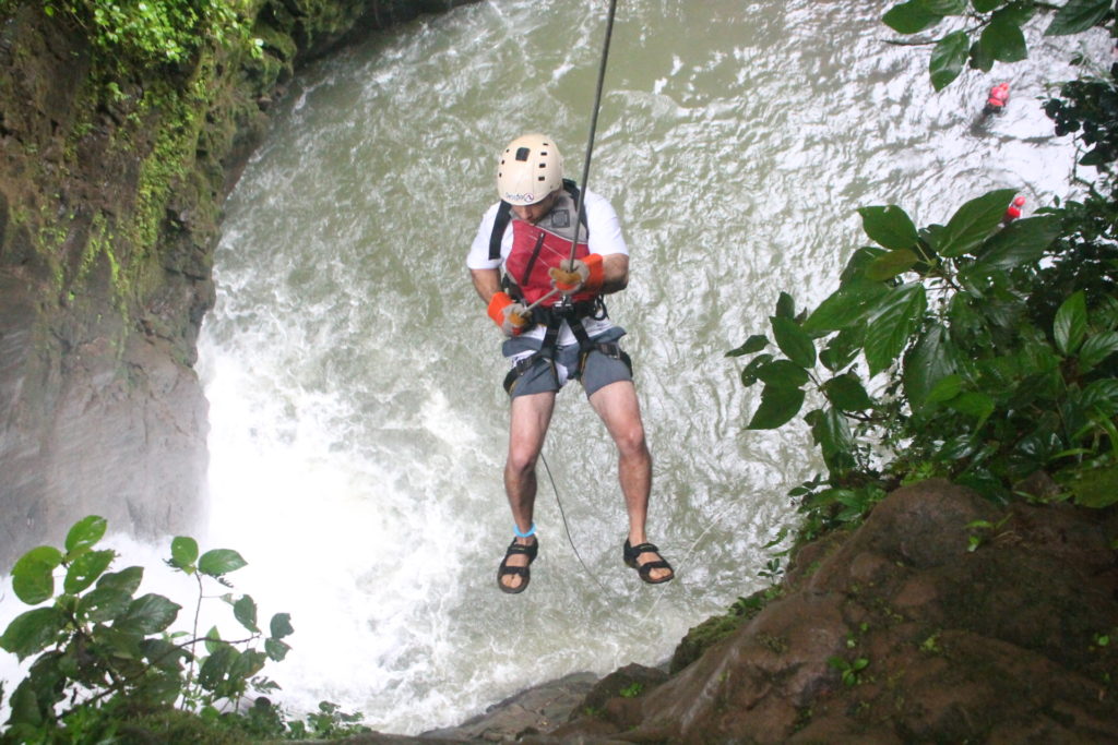 Rappel Down a Cliff Next to Waterfall
